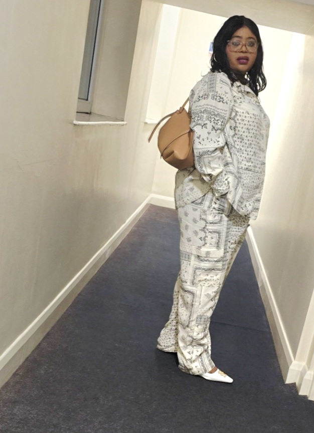 Felicia with tan Charles & Keith crossbody bag